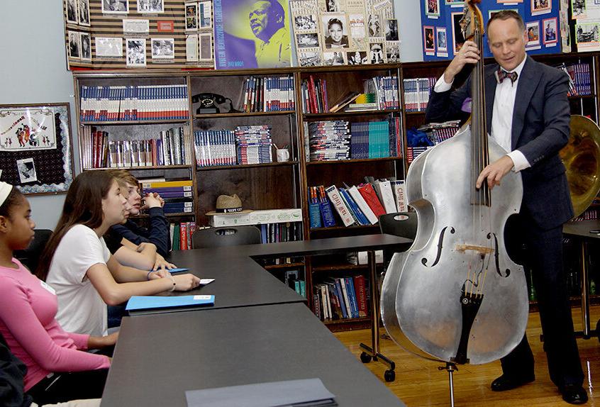 Middle School Harlem Renaissance project guest musician playing standup bass