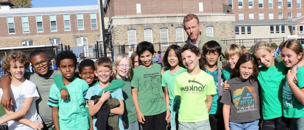 Students dressed in green for solidarity event