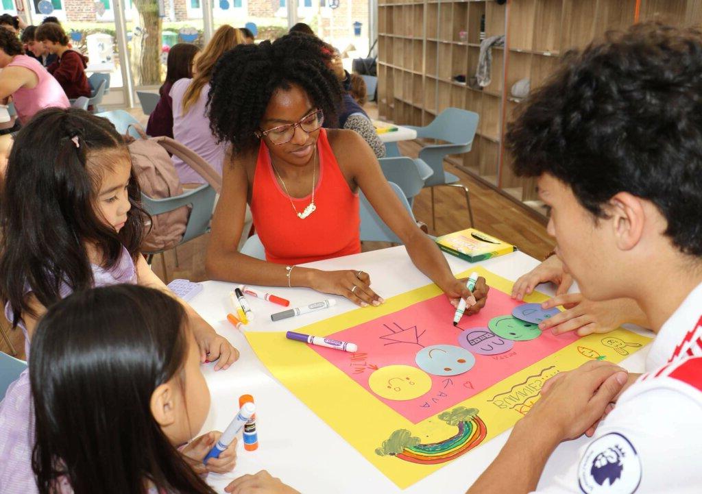 Upper School students working with Lower School Students at Solidarity event at Dyker campus