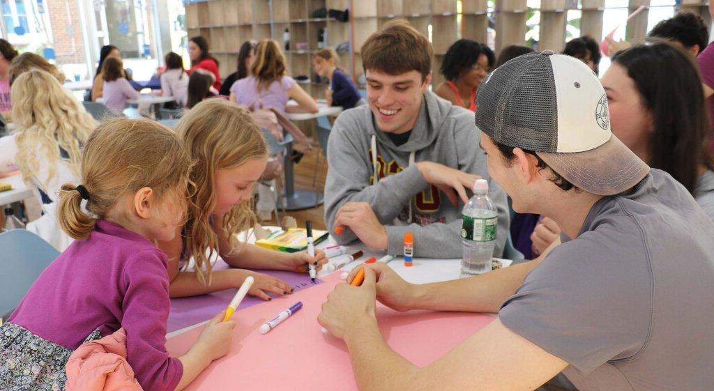 Upper School students working with Lower School Students at Solidarity event at Dyker campus