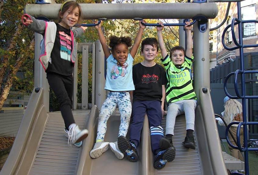 Lower School After School play - children on slide