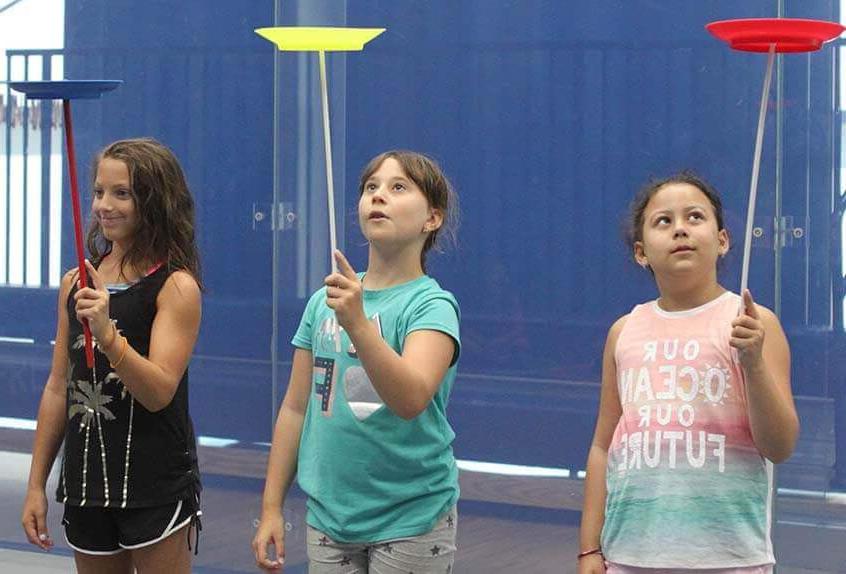 Kids balancing plates at Poly Summer day camp