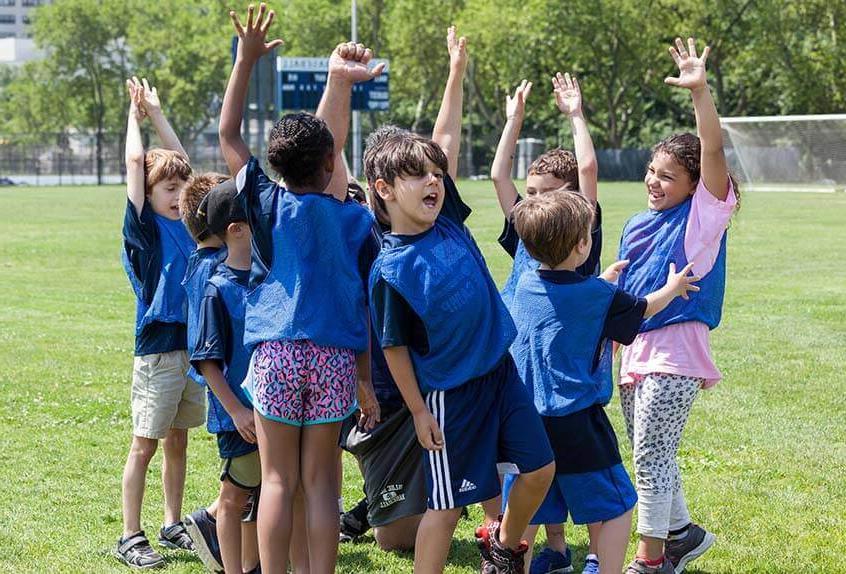 Children cheering at Poly Summer day camp