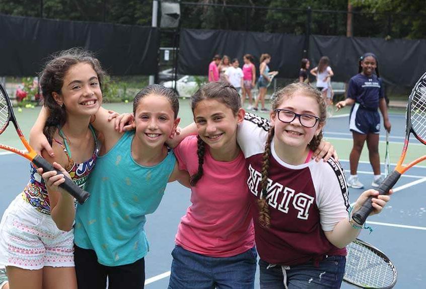 Friends on the tennis court at Poly Summer day camp